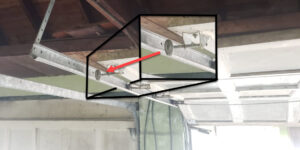 Keeping Garage Door Running Smoothly - 2024-07-10-26576-large-wheel off track 2 – arrow