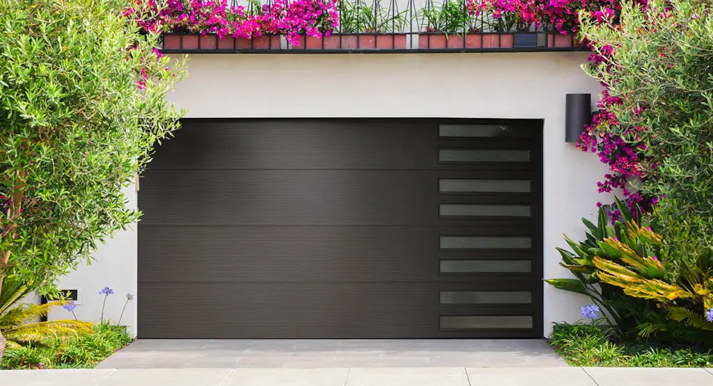 New Garage Doors - Modern,Glass,And,Metal,Garage,Door,Next,To,Sidewalk,In
